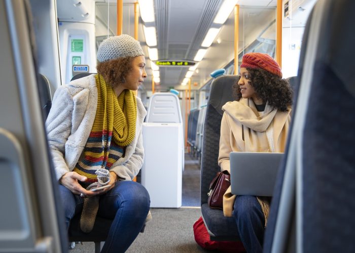 medium-shot-women-traveling-by-train